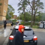 A CCTV screenshot of a thief before they break into an ambulance and steal paramedics' belongings.