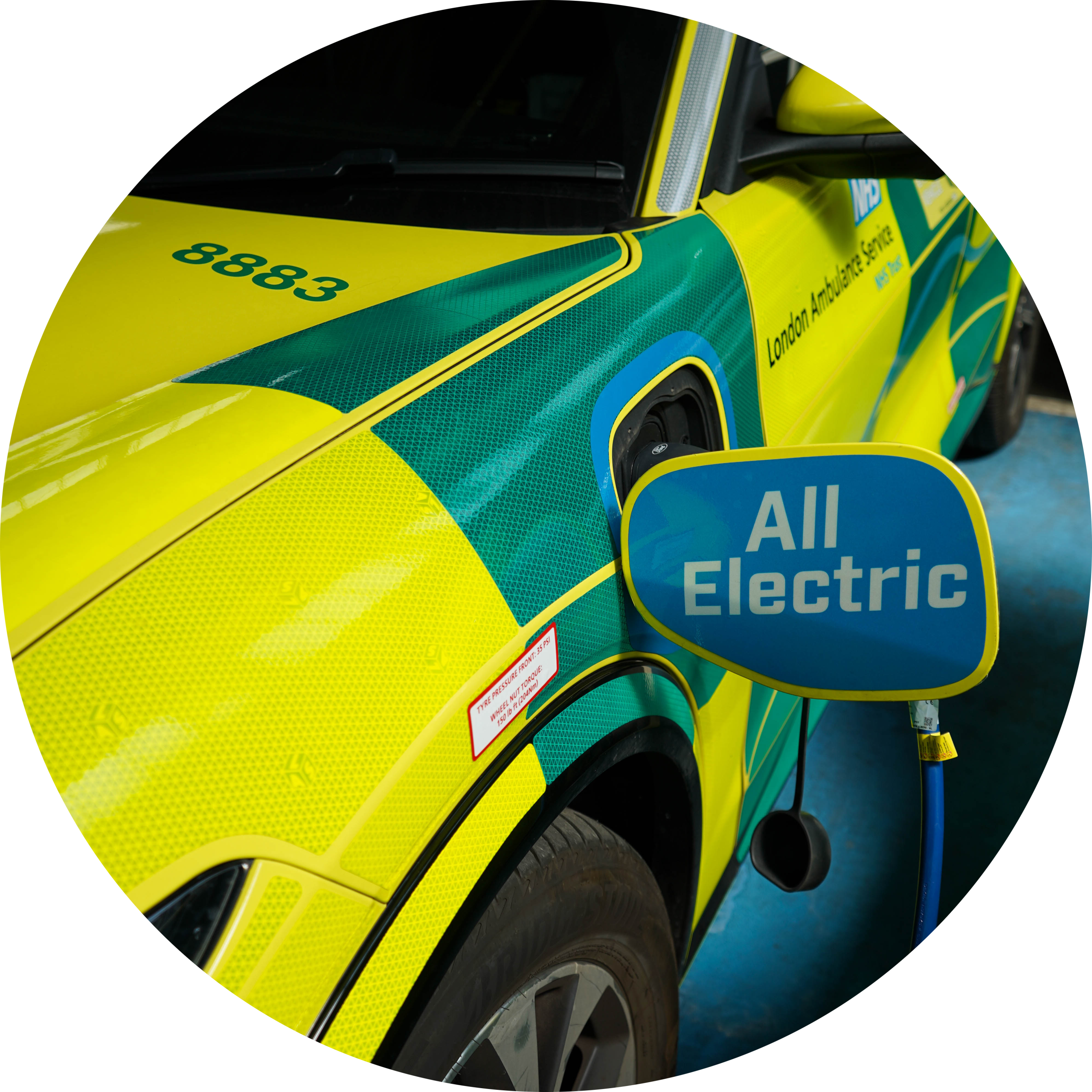 Electric fast-response car being charged ahead of a shift.